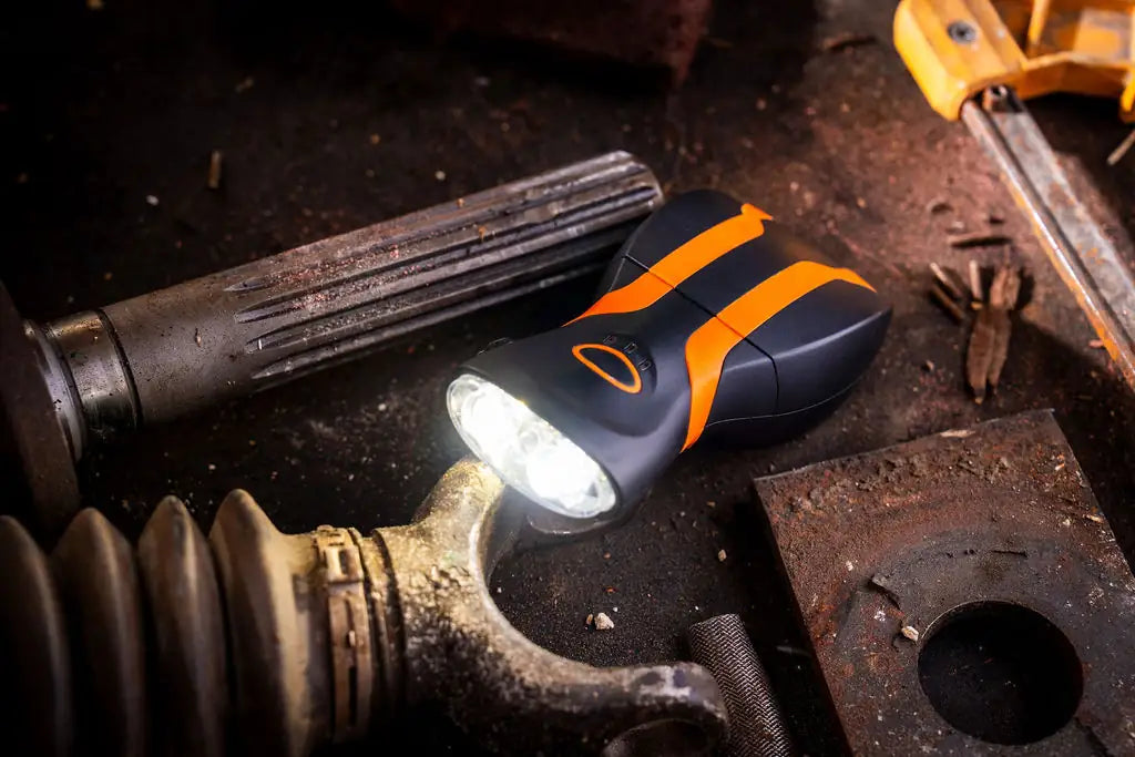 illumibite 2-in-1 hands-free flashlight being used on a workbench for durable task lighting and close-up work