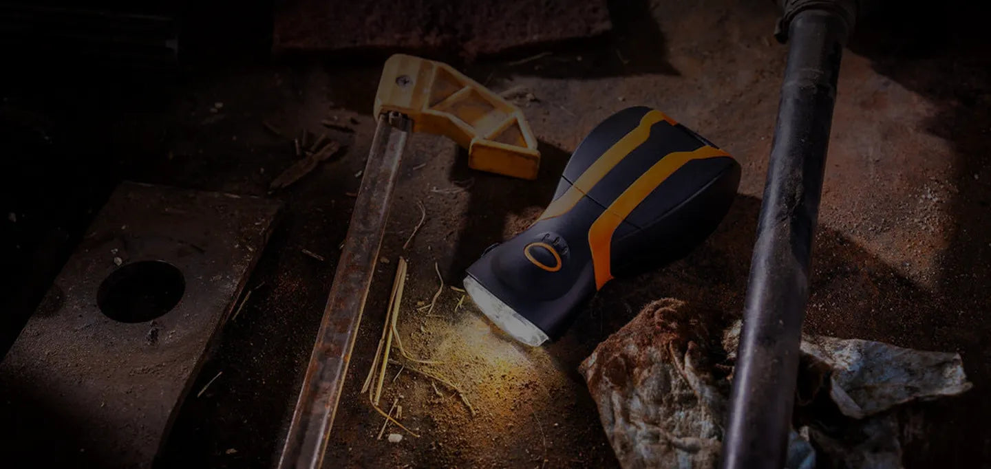 illumibite hands-free flashlight shown in handheld mode resting on workbench