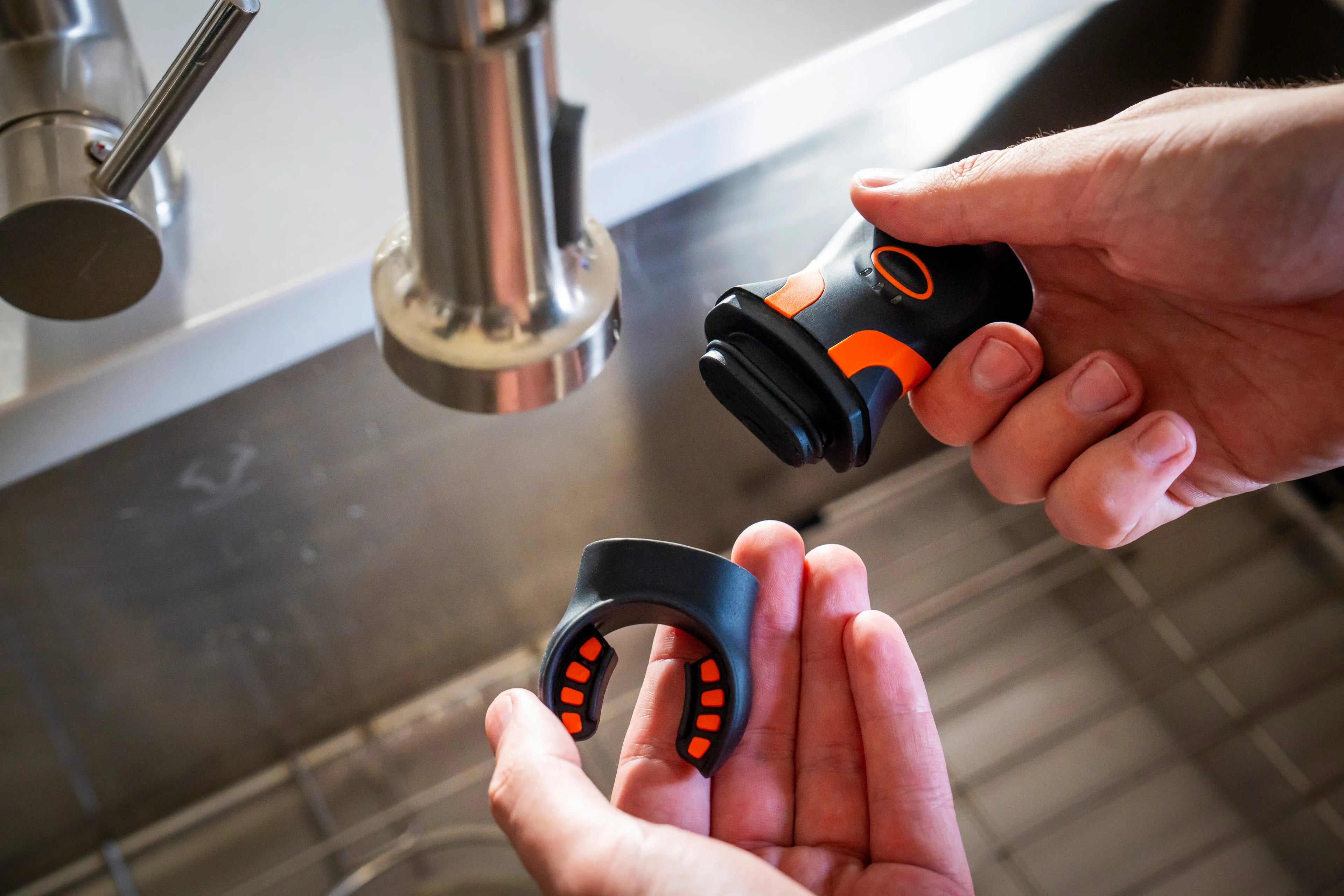 bite grip being removed from the illumibite hands-free flashlight and cleaned for maintenance and hygiene