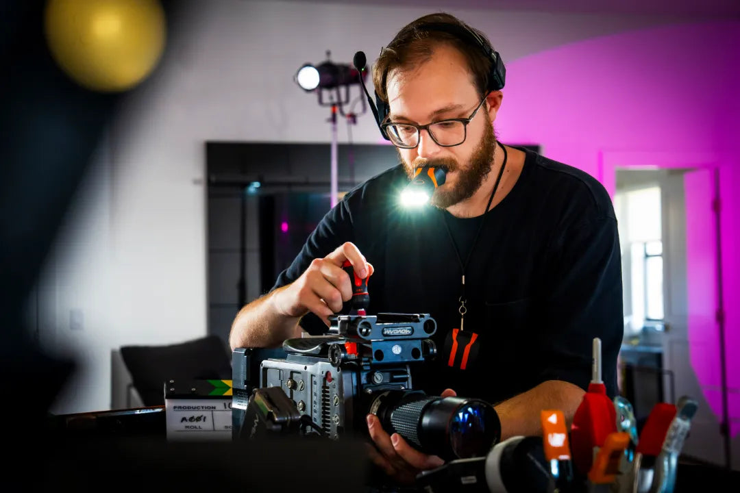 illumibite hands-free flashlight used during camera repair, delivering precise lighting for detailed hands-free work