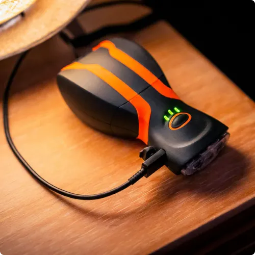 illumibite hands-free flashlight charging with LED indicator lights turned on showing battery status