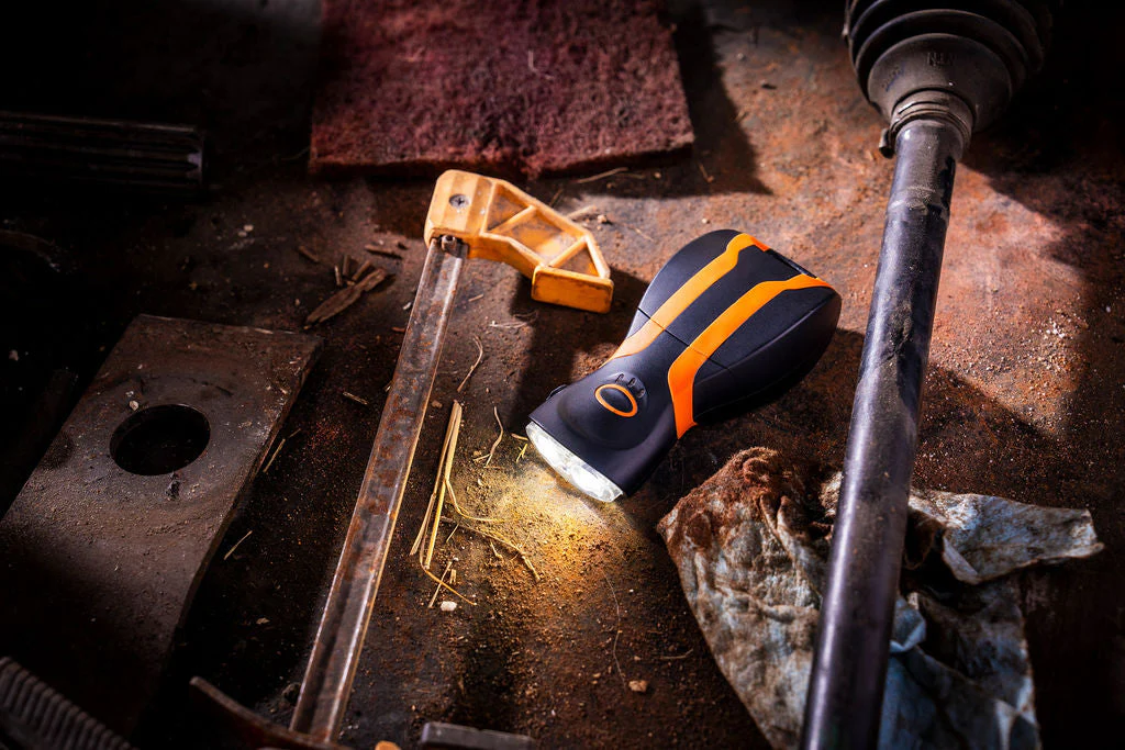 illumibite hands-free flashlight illuminating a workbench for detailed hands-on tasks and repairs
